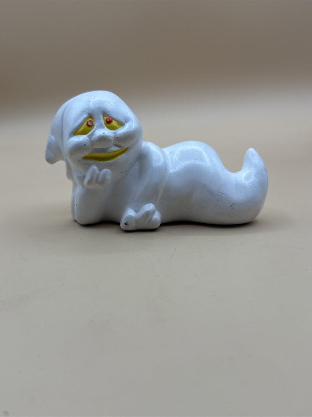 Vintage Porcelain Lying White Ghost Anamorphic Yellow Eye Figurine Spooky Decor